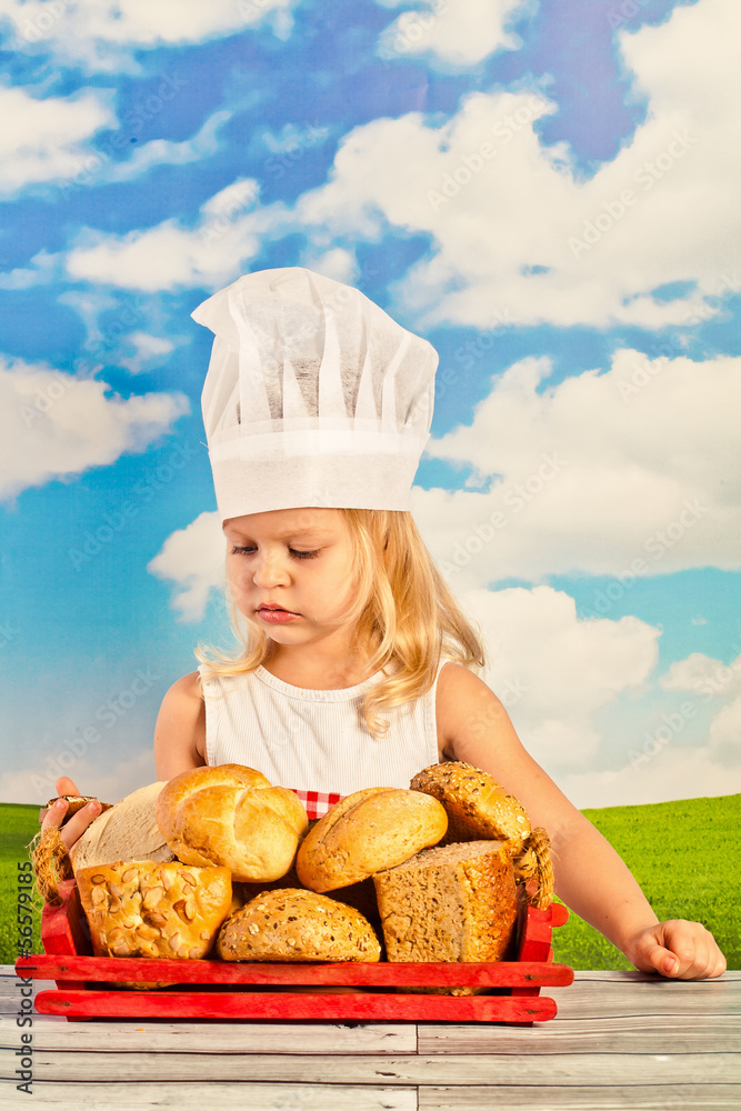 Little girl in chef hat cook healthy soup in a big pot, and prep Little girl in chef hat cook healthy soup in a big pot, and prep