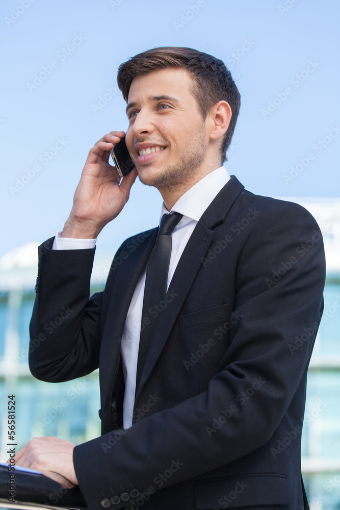 Successful businessman. Cheerful young men in formalwear talking Successful businessman. Cheerful young men in formalwear talking