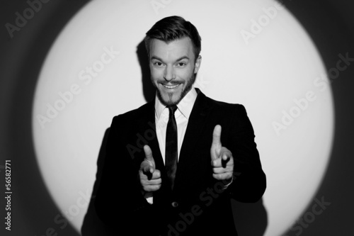 Happy businessman. Black and white image of cheerful young men i
