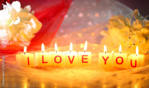 Candles with printed sign I LOVE YOU,on color fabric