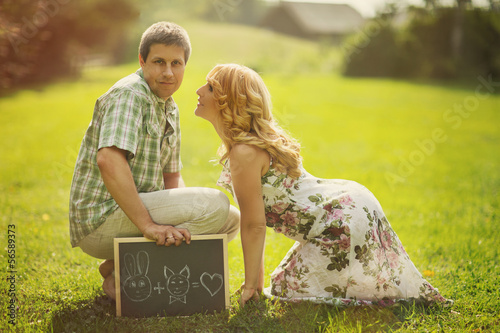 Happy couple with chalkboard photo