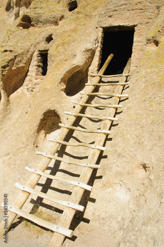 reconstructed ladder into the entrance of a Kiva or room built by the Anazasi indians (circa 1200-1400)  in the South West of the US photo