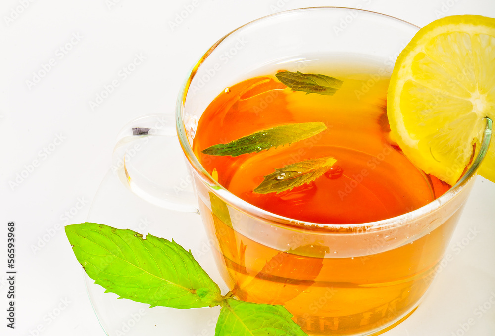tea in cup with leaf mint and lemon