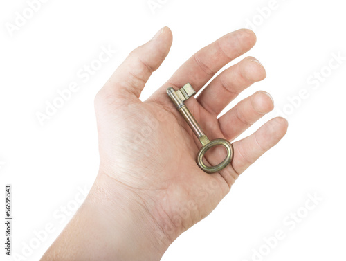 hand holding gold key