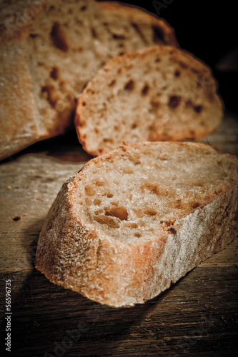 Freshly baked traditional bread on wooden table 