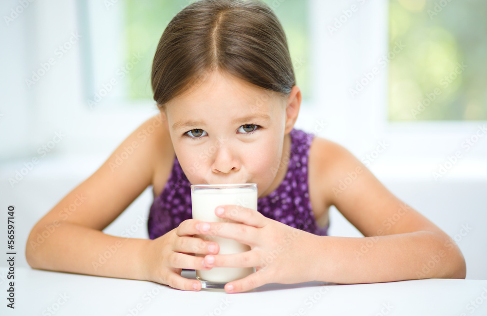 Little girl with a glass of milk Little girl with a glass of milk