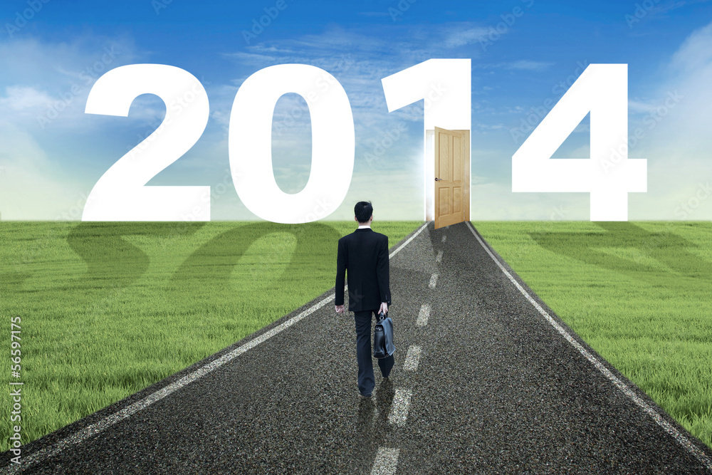 Businessman walks to the future in 2014 Businessman walks to the future in 2014