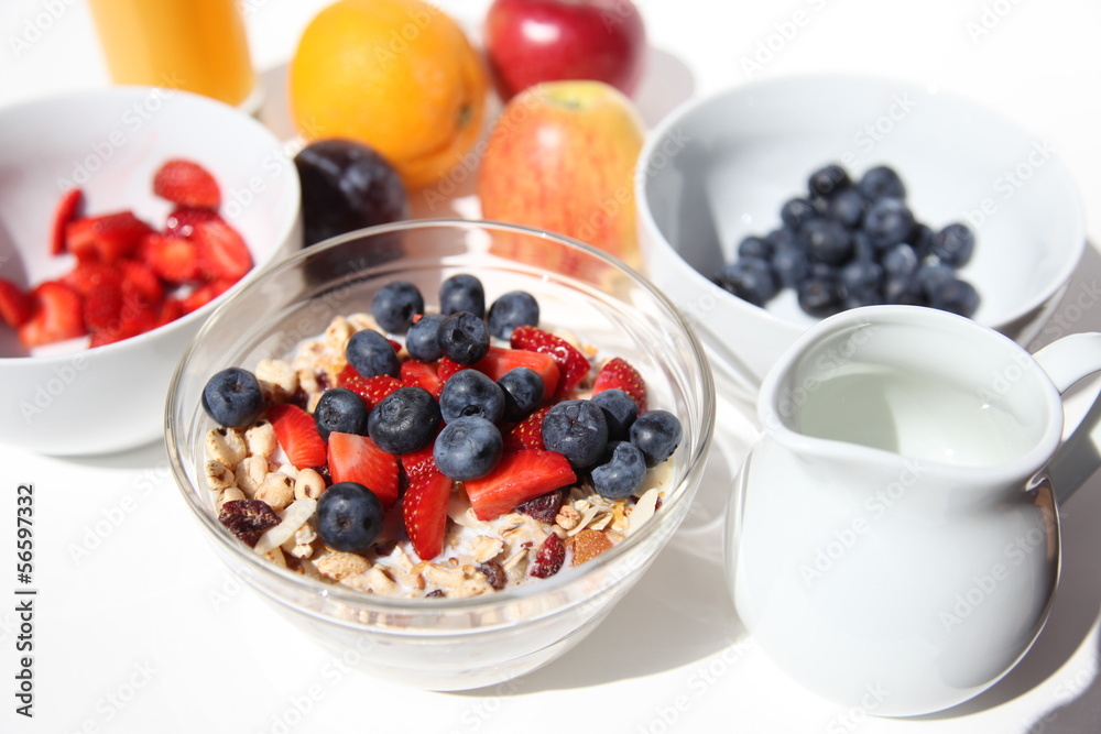Muesli bowl with fresh fruits, bright sunlight