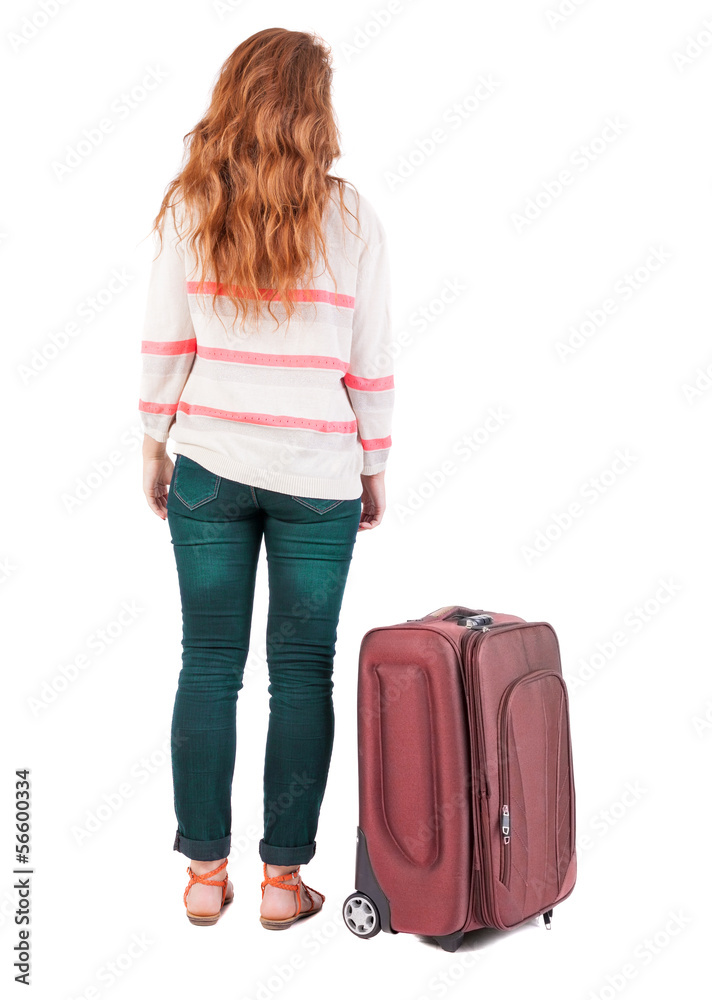 back view of walking woman with suitcase. back view of walking woman with suitcase.