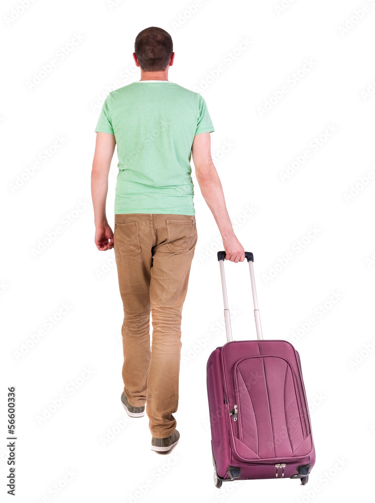 back view of walking man with suitcase. back view of walking man with suitcase.