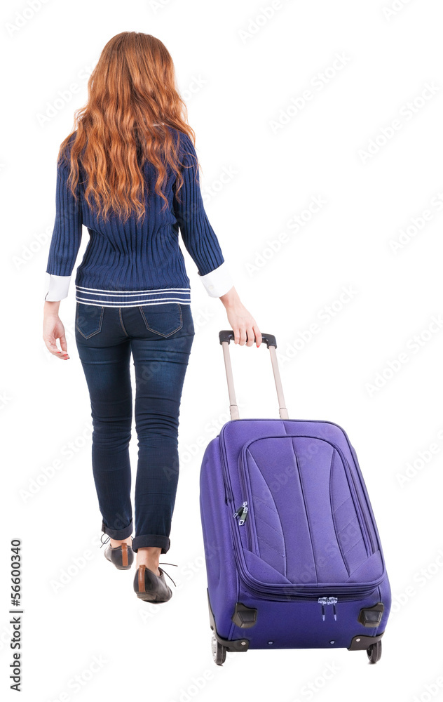 back view of walking woman with suitcase back view of walking woman with suitcase