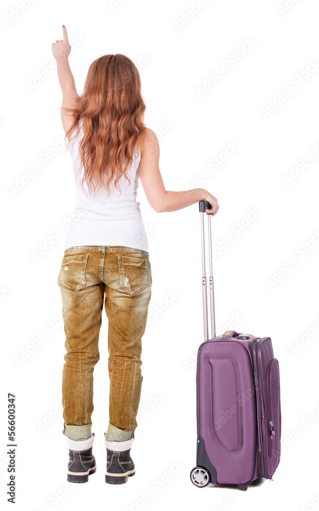 Back view of pointing woman with suitcase looking up Back view of pointing woman with suitcase looking up