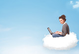 Young woman with laptop sitting on cloud with copy space