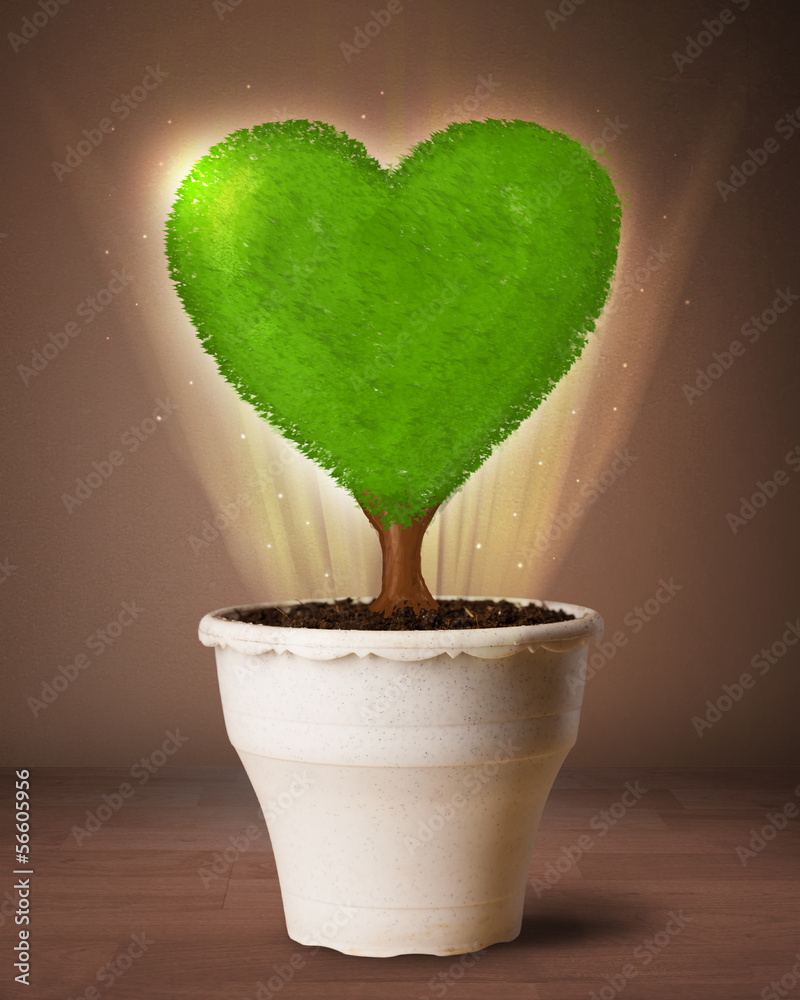 Eco heart tree coming out from flowerpot Eco heart tree coming out from flowerpot