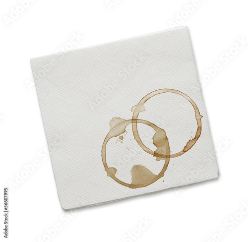 Paper napkin with coffee stains isolated on white background