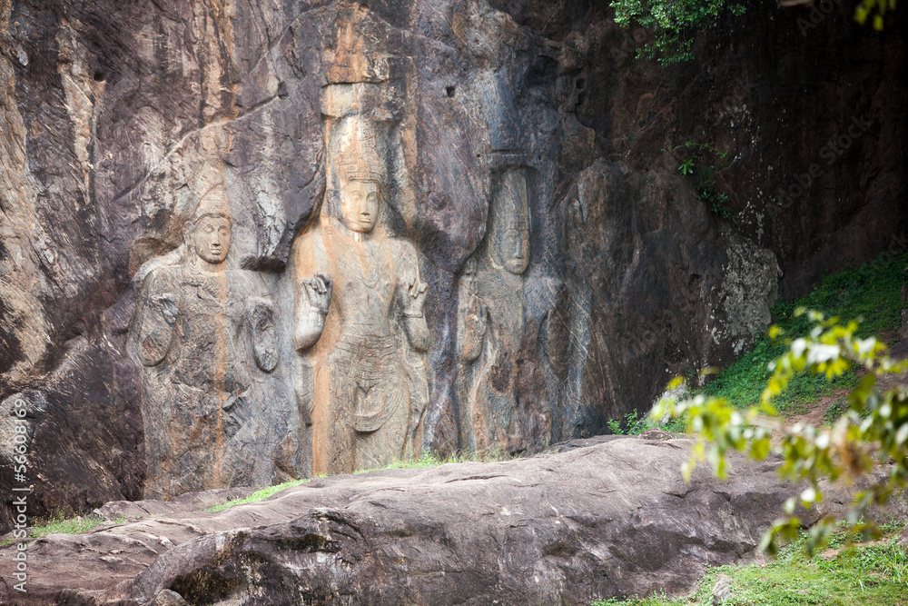 Buddha statues carved in rock at Buduruvagala temple in Sri Lank Buddha statues carved in rock at Buduruvagala temple in Sri Lank