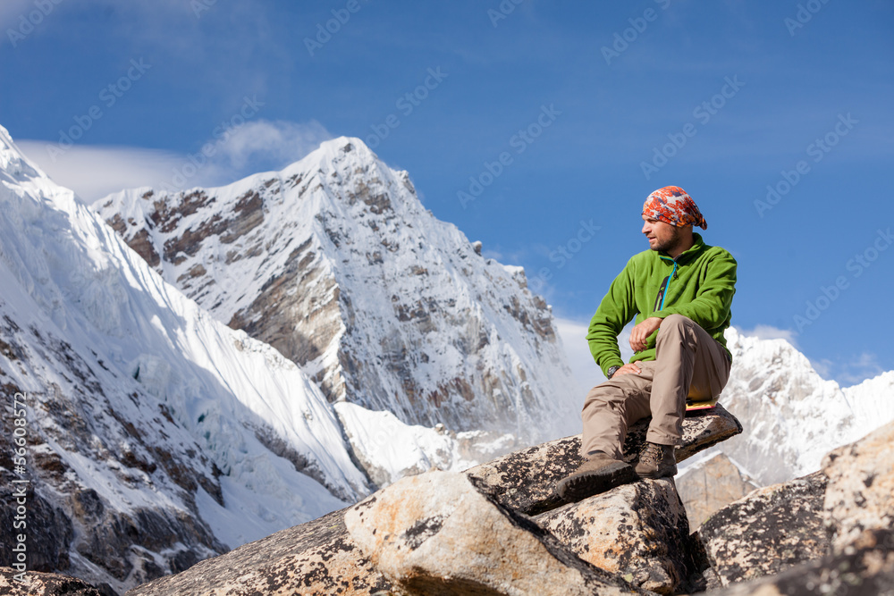 Hiker rests on the trek in Himalayas, Nepal