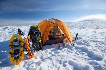 Camping during winter hiking in Carpathian mountains