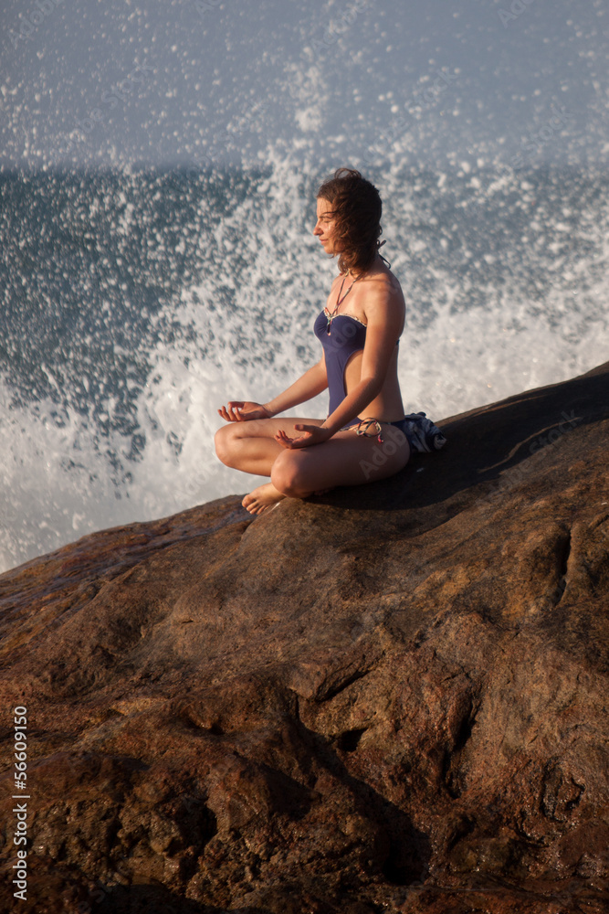 Fototapeta premium Woman takes rest at the sea shore