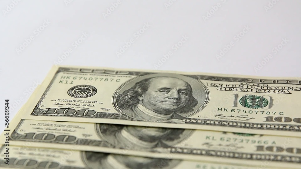 One hundred dollar bills a white background. One hundred dollar bills a white background.