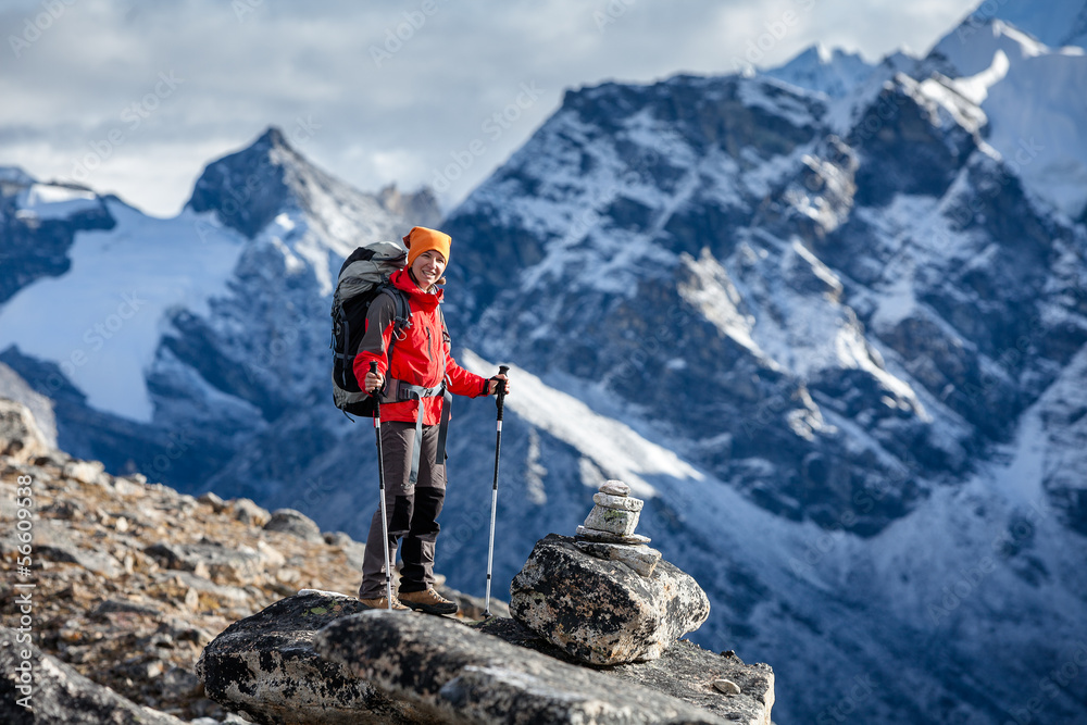 Hiker posing at camera on the trek in Himalayas, Nepal