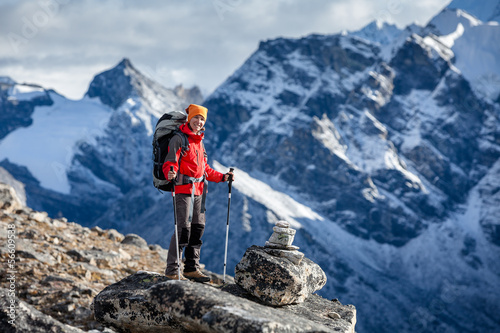 Hiker posing at camera on the trek in Himalayas, Nepal