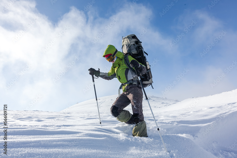 Hiker walking in winter Carpathian mountains Hiker walking in winter Carpathian mountains