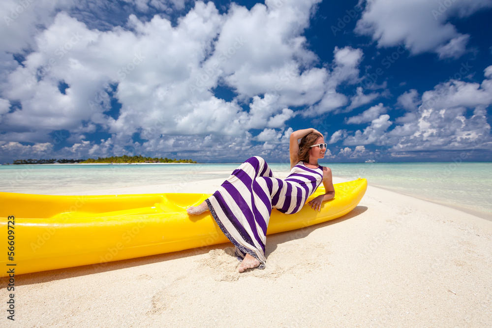 Caucasian woman rests at beautiful seashore Caucasian woman rests at beautiful seashore