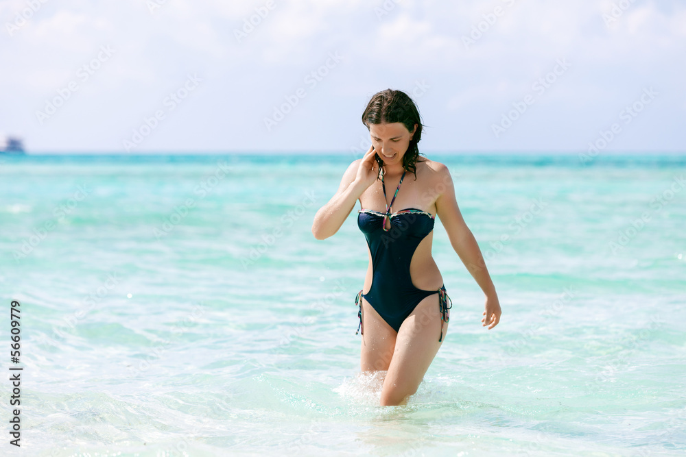 Caucasian woman rests at beautiful seashore