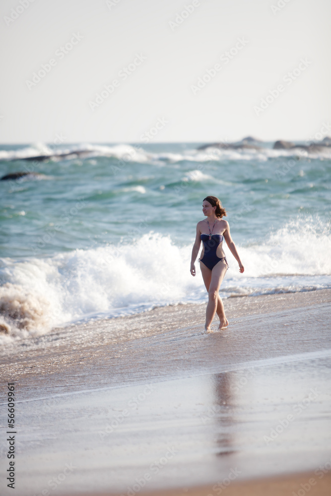 Woman takes rest at the sea shore Woman takes rest at the sea shore