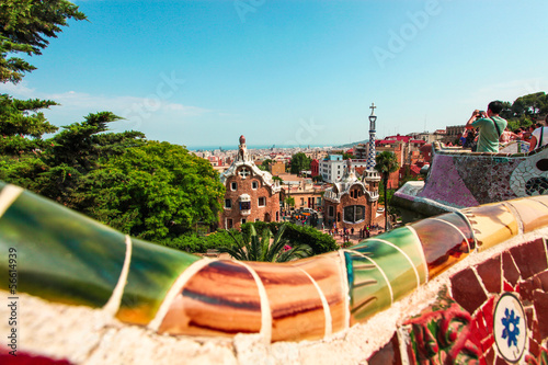 The Famous Summer Park Guell over bright blue sky in Barcelona photo