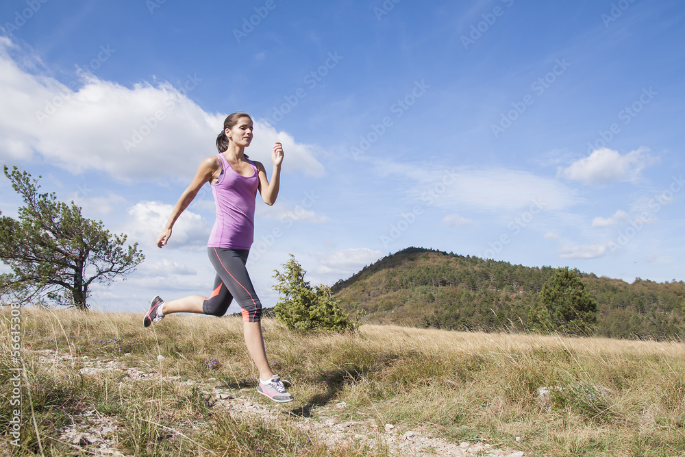 Young woman running outdoors in the nature Young woman running outdoors in the nature