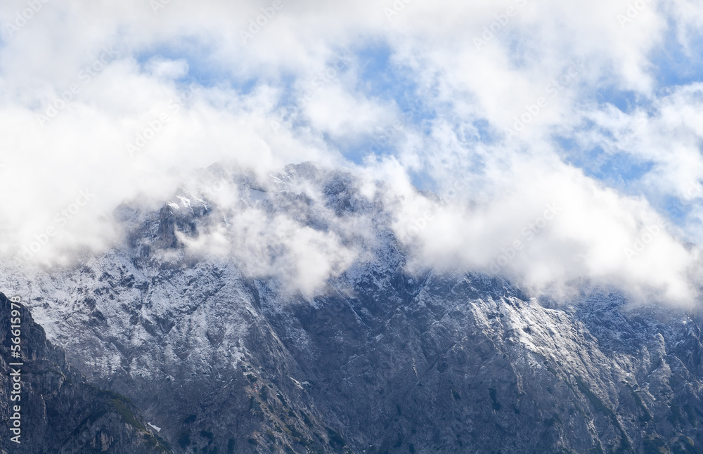 high mountain peak in white clouds high mountain peak in white clouds