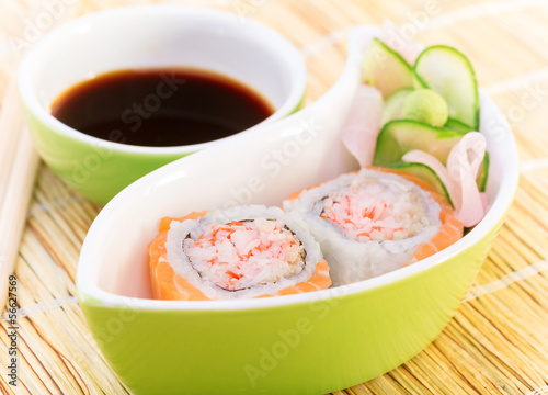 Tasty sushi with soy sauce