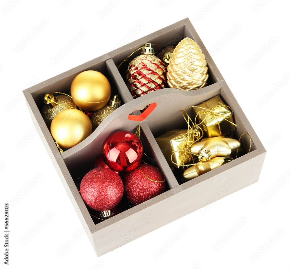 Wooden box filled with christmas decorations, isolated on white Wooden box filled with christmas decorations, isolated on white