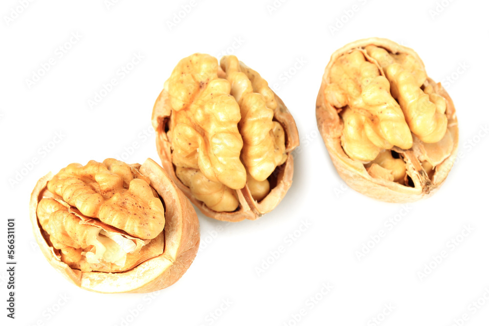 Broken walnuts isolated on white Broken walnuts isolated on white