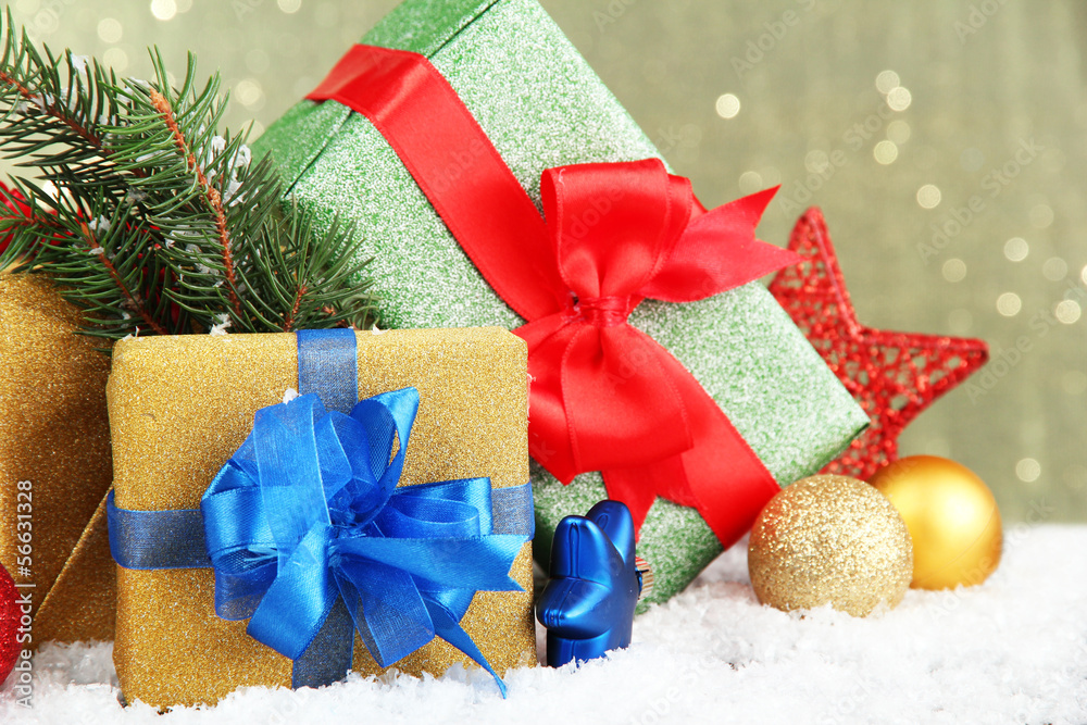 Beautiful bright gifts and christmas decor, on shiny background Beautiful bright gifts and christmas decor, on shiny background