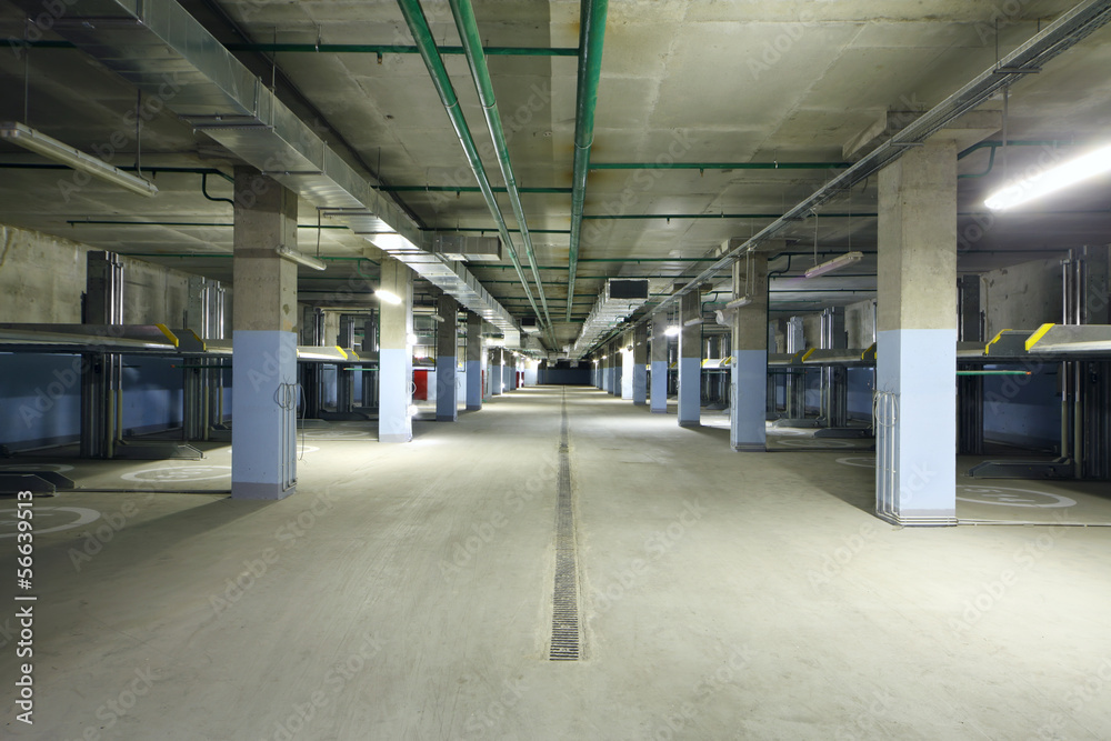Large indoor two-level parking with electrolifts for many cars. Large indoor two-level parking with electrolifts for many cars.