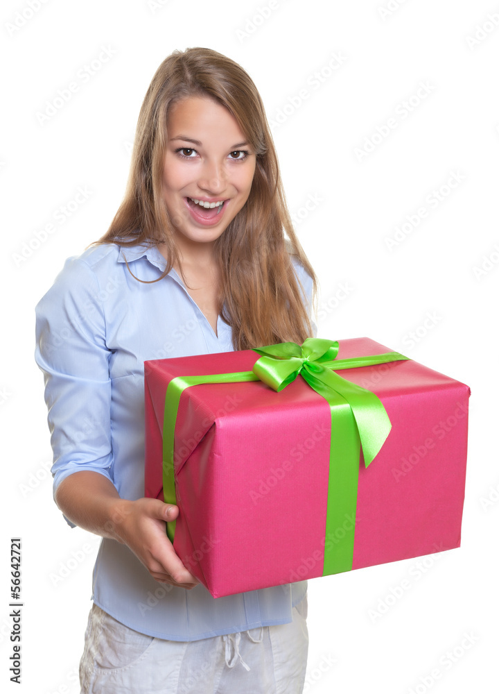 Surprised woman with a christmas gift Surprised woman with a christmas gift