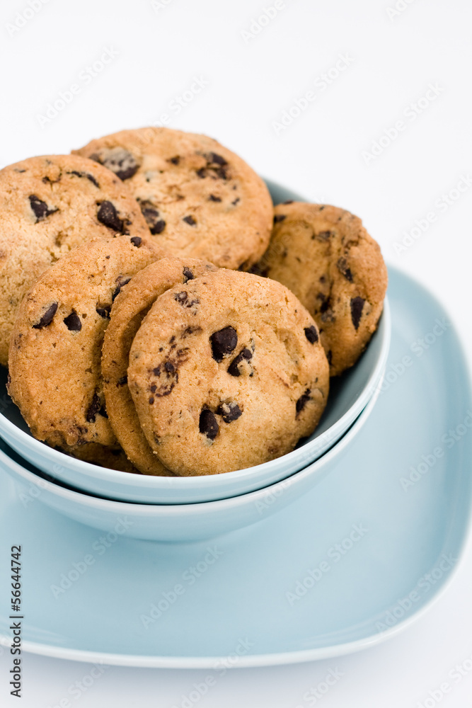 Tasty cookies with chocolate lying on a blue plate Tasty cookies with chocolate lying on a blue plate