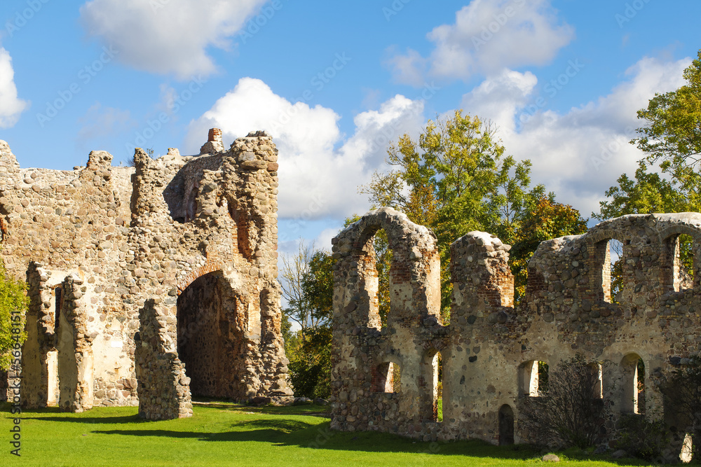 Old castle ruins on a blue sky background