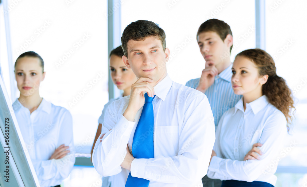 businessmen are meeting near the flipchart businessmen are meeting near the flipchart
