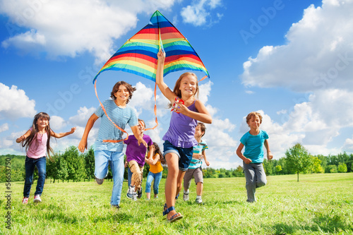 Many active kids with kite photo