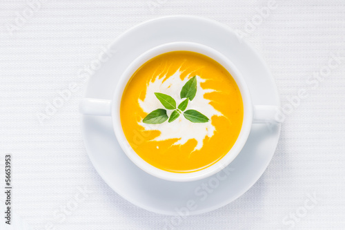 Pumpkin soup on served table. Top view