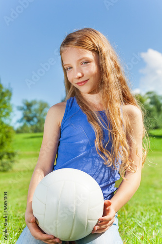 Happy girl holds ball
