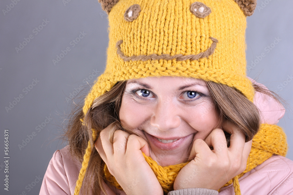 cheerful girl in a funny yellow hat and a jacket cheerful girl in a funny yellow hat and a jacket