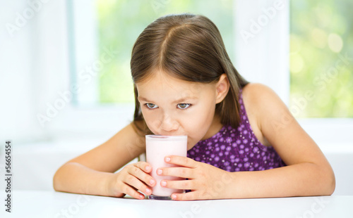 Little girl with a glass of milk