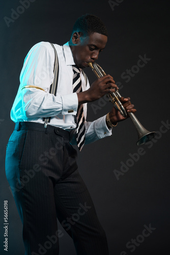 Retro african american jazz musician playing on his trumpet. Wea