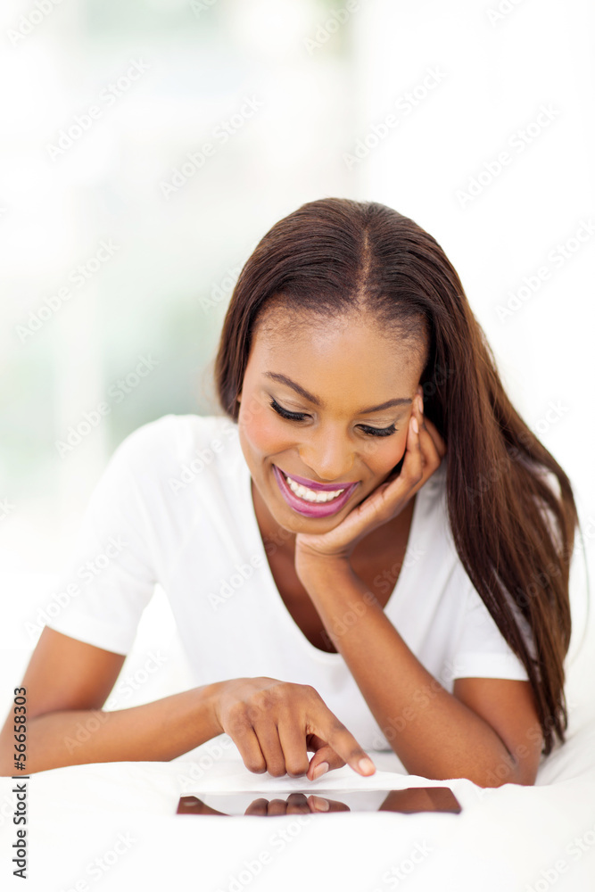african american woman using tablet compter at home african american woman using tablet compter at home