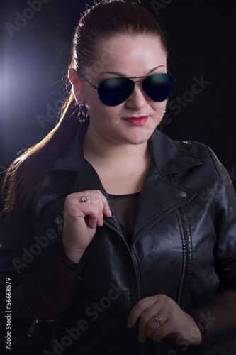 Woman with leather jacket and glasses